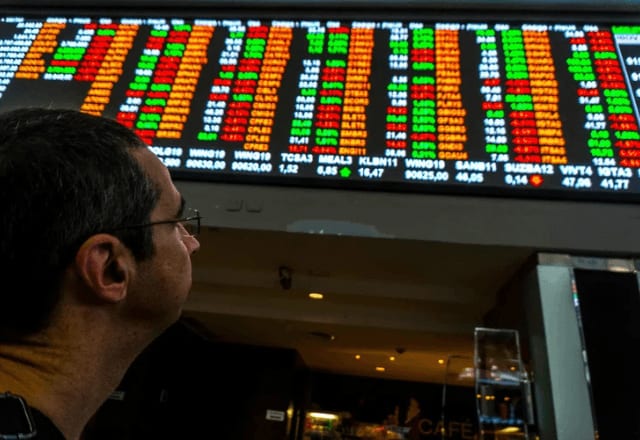 Bolsa e dólar amenizam reação à reeleição de Lula