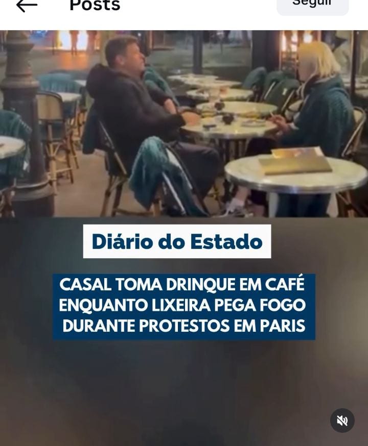 Casal toma café em Paris enquanto lixeira queima perto do Arco do Triunfo